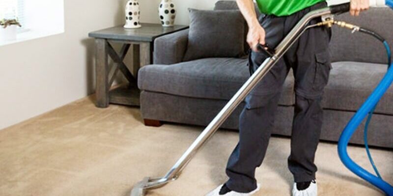 professional carpet cleaning services professional carpet cleaner vacuuming a carpet